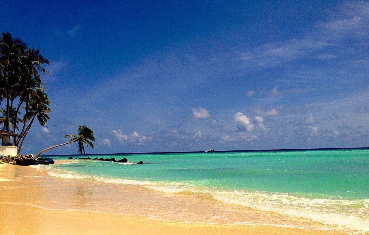 Turquoise water and golden sand on the beach at Maafushi